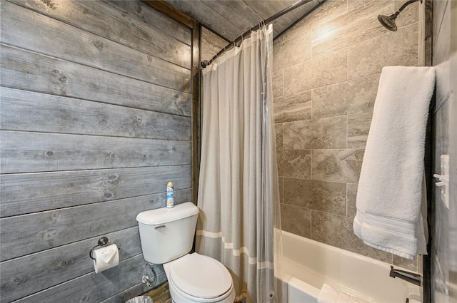 bathroom featuring shower / bath combo and toilet