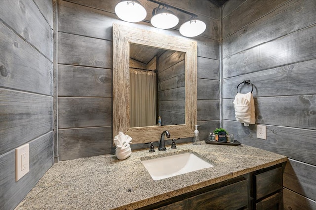 bathroom with a shower with curtain and vanity