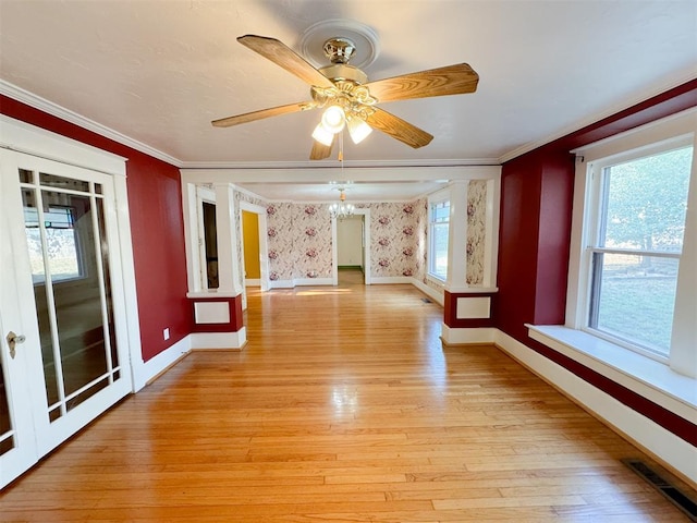 unfurnished room featuring ceiling fan, ornamental molding, and light hardwood / wood-style flooring