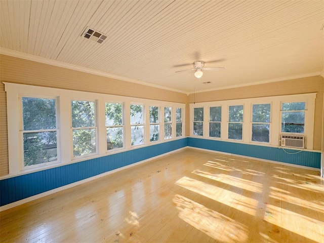 unfurnished sunroom with ceiling fan and cooling unit