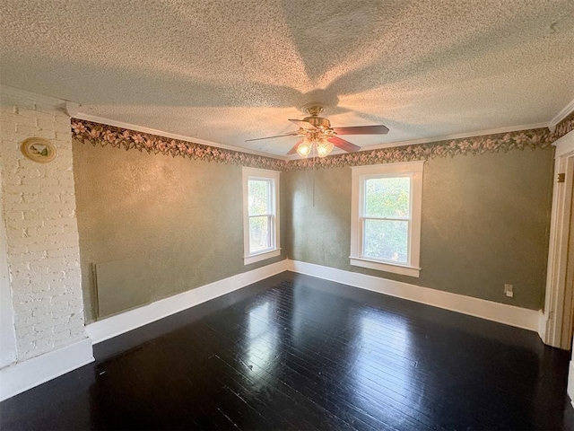 unfurnished room featuring ornamental molding, a textured ceiling, and hardwood / wood-style flooring