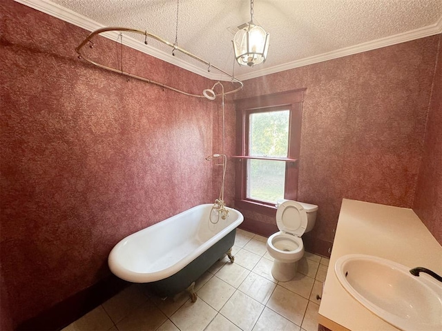 bathroom featuring a textured ceiling, crown molding, tile patterned flooring, toilet, and a tub