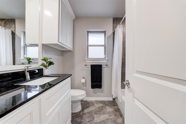 full bathroom featuring vanity, toilet, and shower / tub combo with curtain