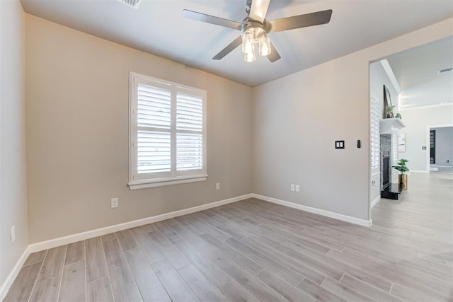 spare room with ceiling fan and light hardwood / wood-style floors