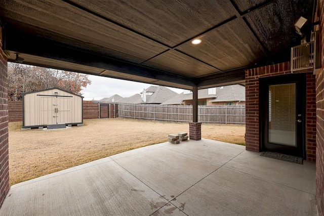 view of patio featuring a storage shed