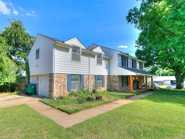 view of front of house featuring a front yard, a porch, and a garage