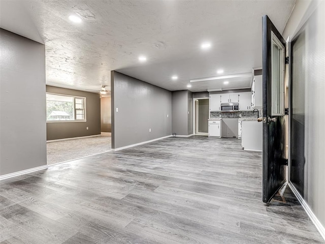 unfurnished living room with light hardwood / wood-style flooring