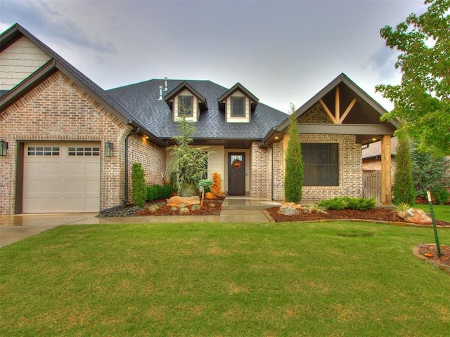 view of front facade with a garage and a front lawn