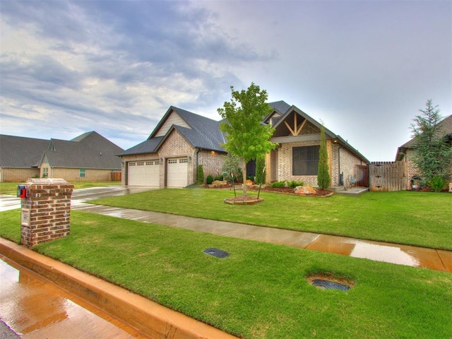 craftsman house featuring a garage and a front yard