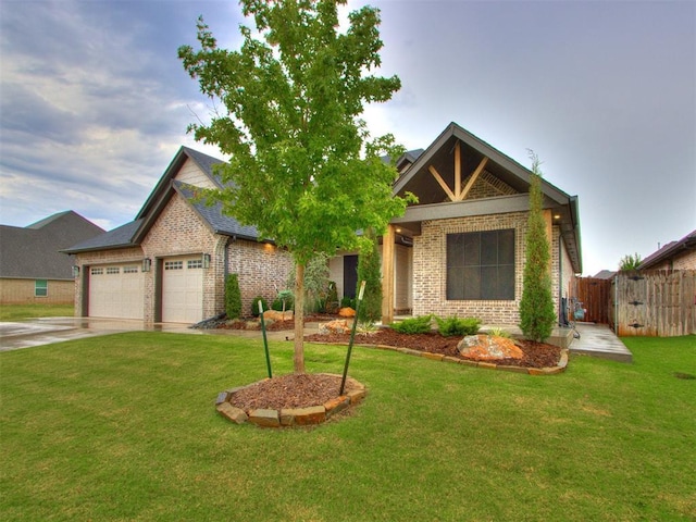 view of front of home featuring a garage and a front yard