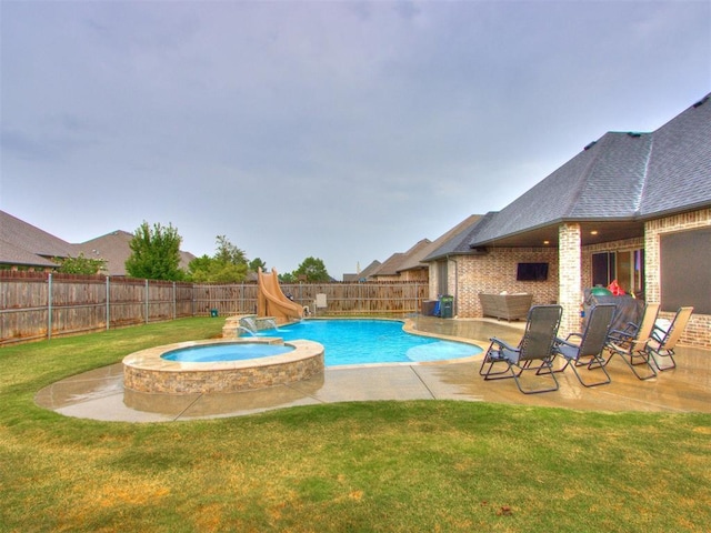 view of pool with a water slide, a lawn, a patio, and an in ground hot tub