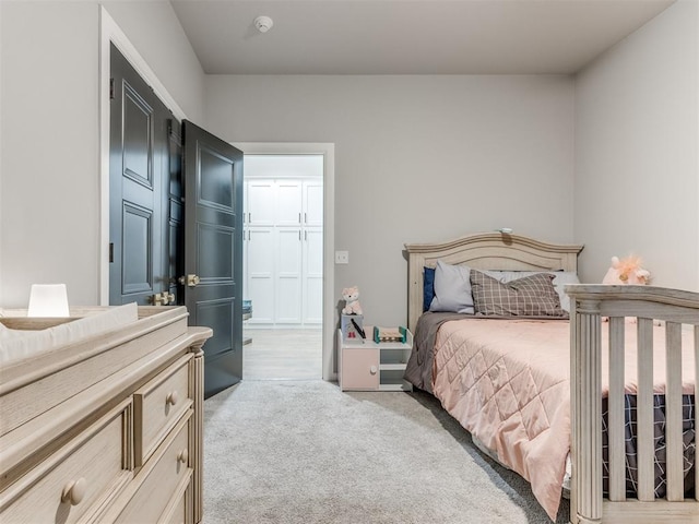 carpeted bedroom with a closet