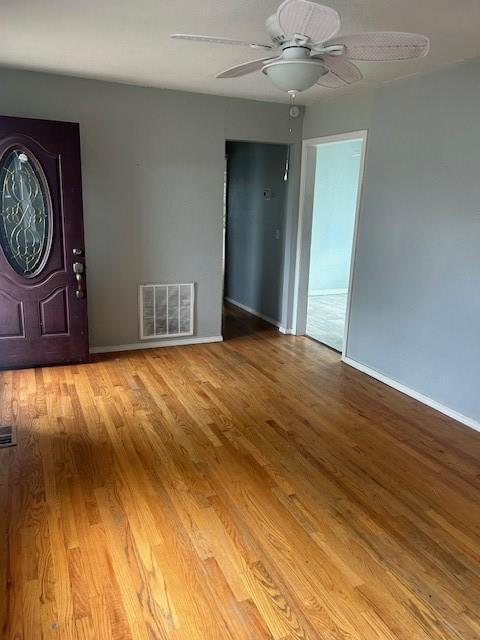 foyer entrance featuring light hardwood / wood-style floors and ceiling fan