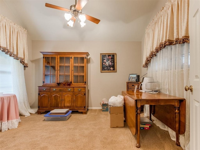 office space with light colored carpet and ceiling fan