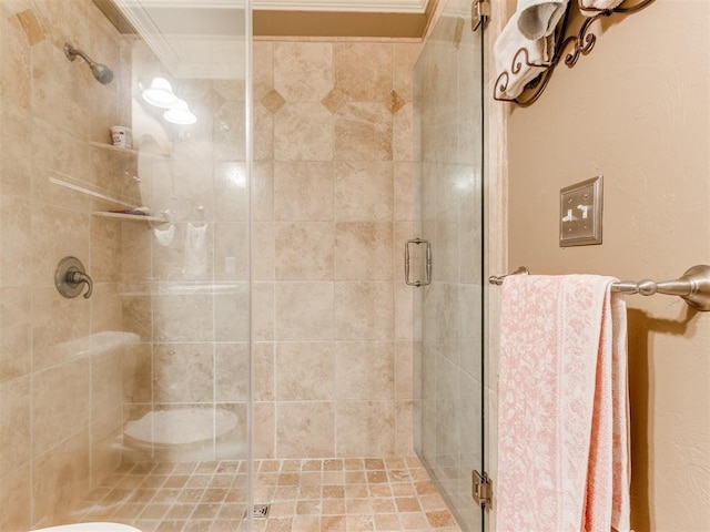 bathroom with walk in shower and crown molding