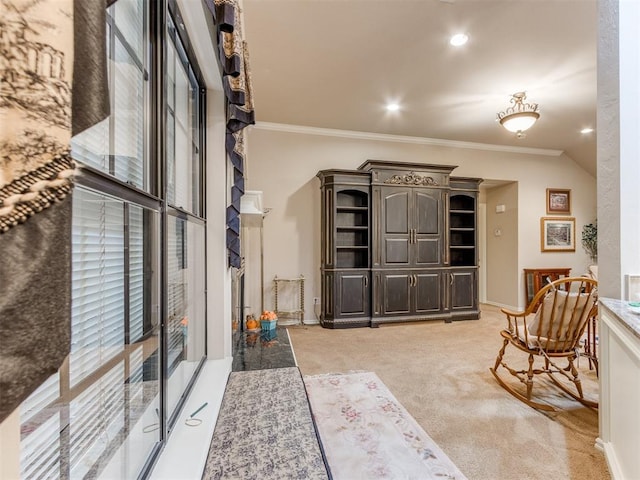 interior space with light colored carpet and ornamental molding