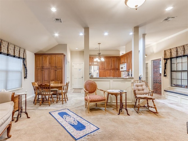 living area with light colored carpet, vaulted ceiling, and a notable chandelier