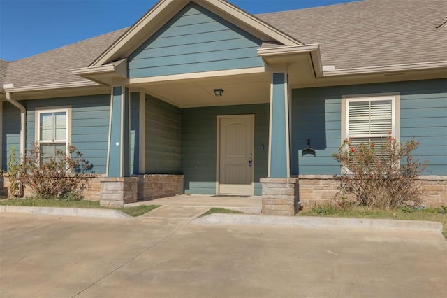 view of exterior entry featuring a porch