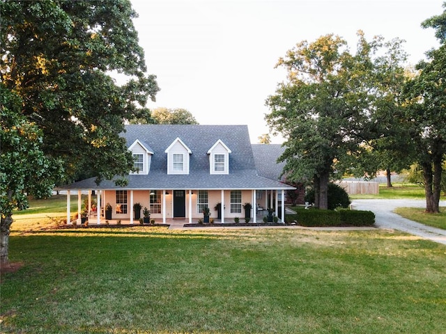 view of front of property with a front lawn and a porch