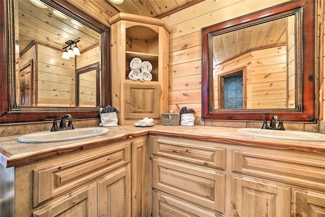 bathroom with vanity, wooden ceiling, and wooden walls