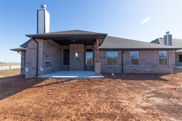 rear view of house with a patio