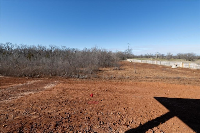 view of yard with a rural view