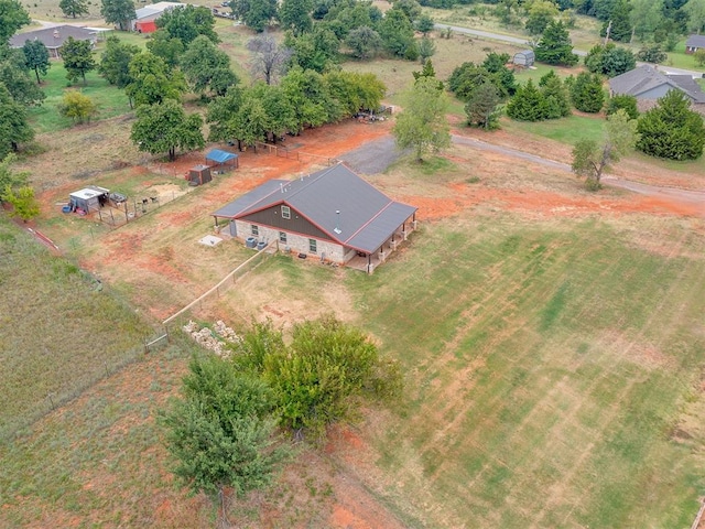 birds eye view of property with a rural view