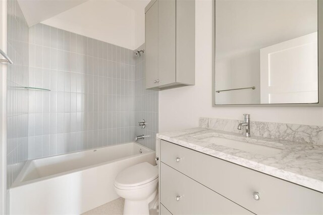bathroom with toilet, bathtub / shower combination, and vanity