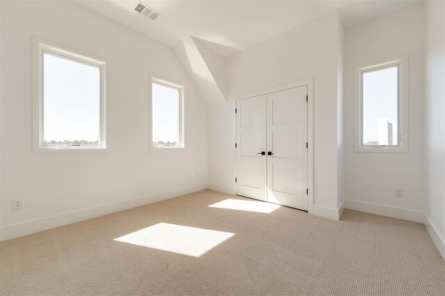 bonus room featuring carpet floors, baseboards, and visible vents