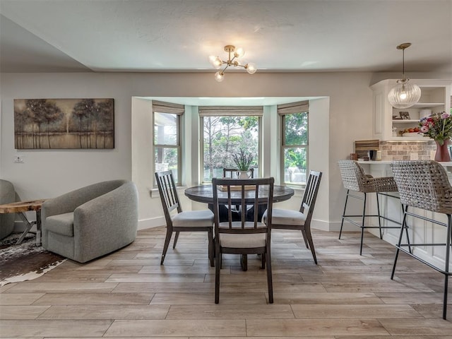 dining room featuring a chandelier and light hardwood / wood-style floors