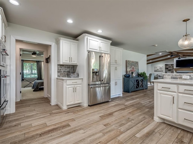 kitchen with pendant lighting, white cabinets, vaulted ceiling with beams, light wood-type flooring, and high quality fridge