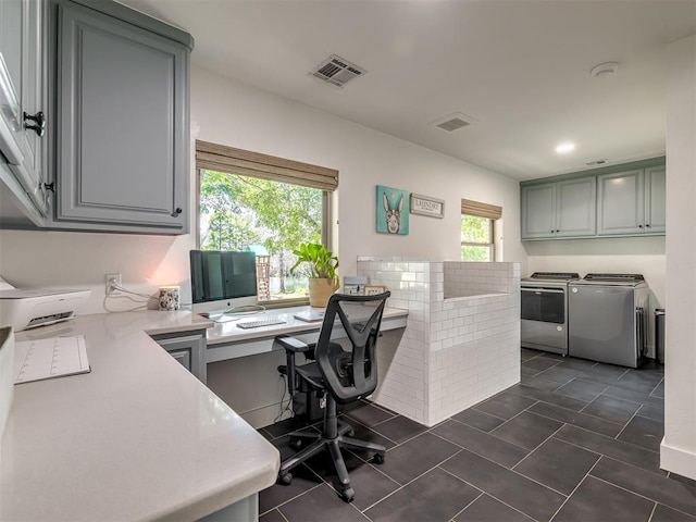 tiled office with independent washer and dryer and a healthy amount of sunlight