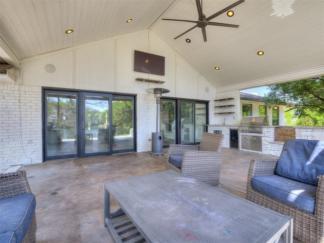 view of patio / terrace featuring area for grilling and ceiling fan