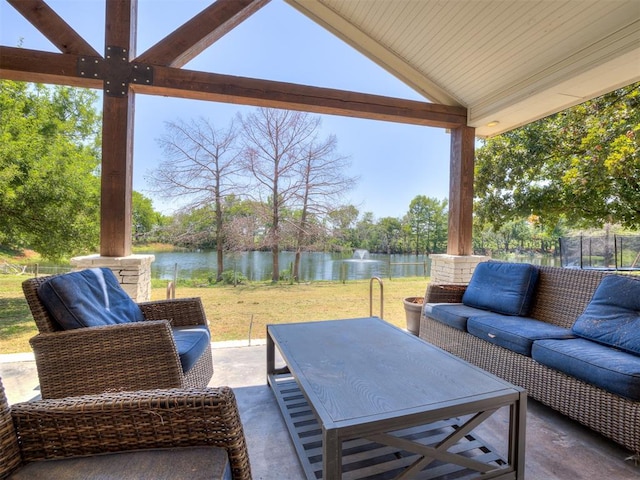 view of patio / terrace featuring a water view, an outdoor hangout area, and a trampoline