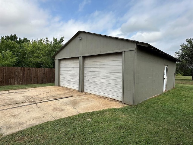 garage featuring a lawn