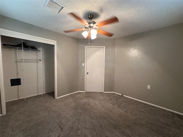 unfurnished bedroom with ceiling fan, a closet, carpet, and a textured ceiling