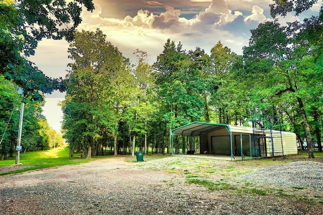 yard at dusk with a carport