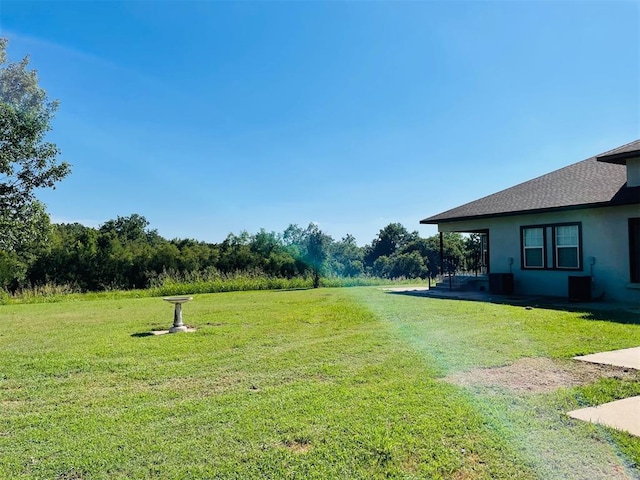 view of yard with central AC unit