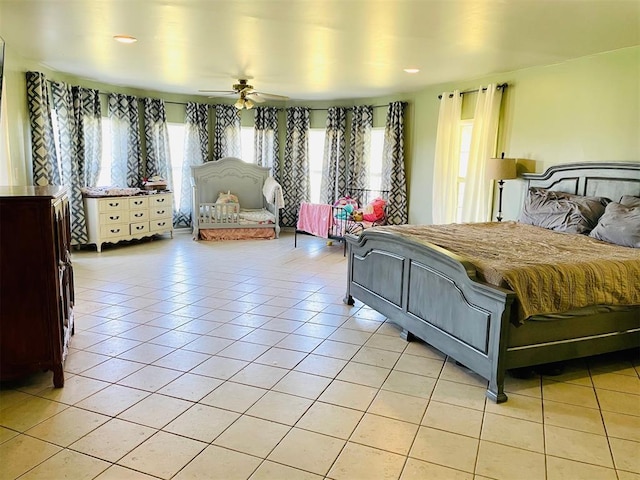 bedroom featuring multiple windows and light tile patterned flooring