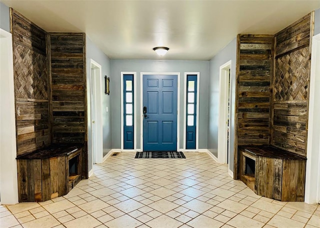 foyer entrance featuring light tile patterned flooring