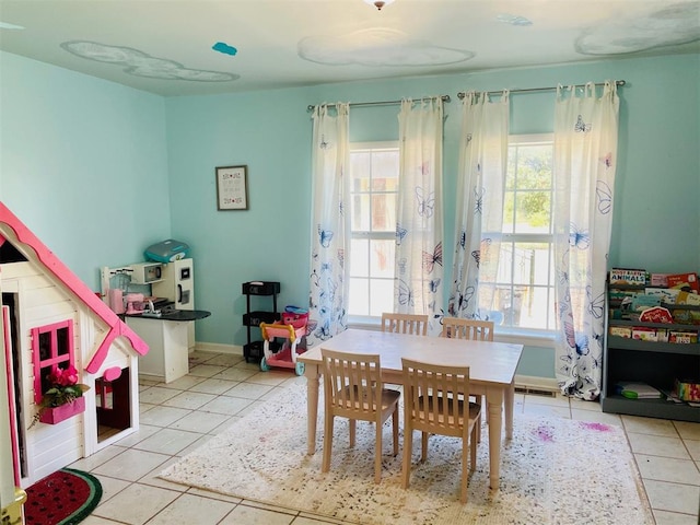 game room with light tile patterned floors