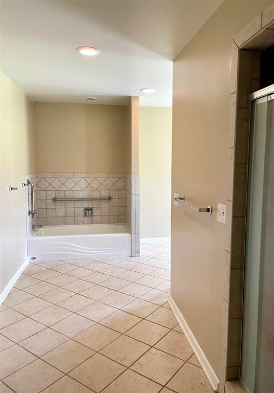 bathroom featuring a washtub and tile patterned floors