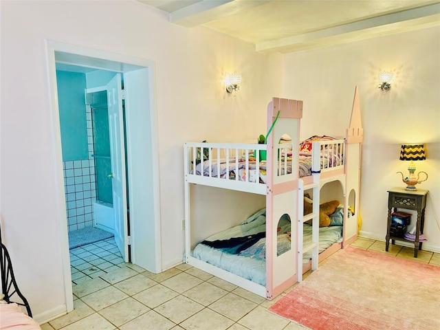 bedroom with tile patterned floors and beamed ceiling