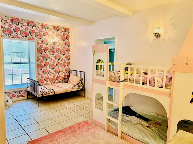 bedroom with beamed ceiling and tile patterned flooring