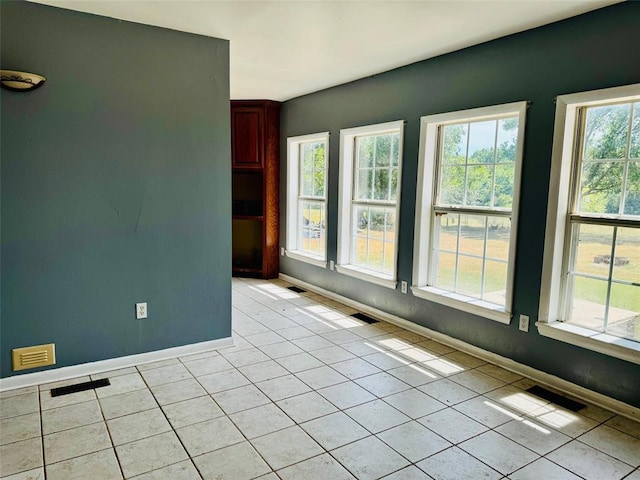 spare room with light tile patterned floors