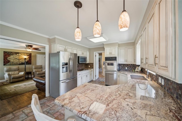 kitchen with sink, backsplash, crown molding, decorative light fixtures, and appliances with stainless steel finishes