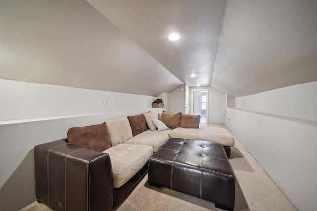 cinema featuring lofted ceiling and light carpet