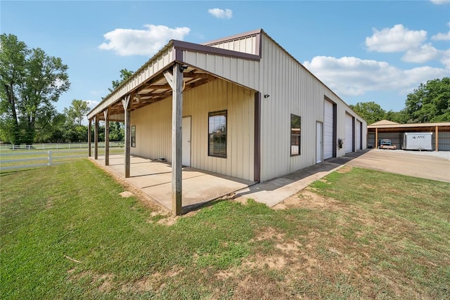 view of home's exterior featuring a garage and an outdoor structure