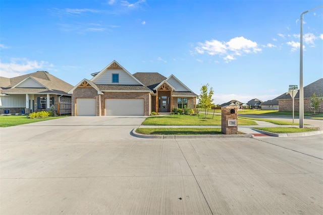 craftsman-style home featuring a garage and a front lawn