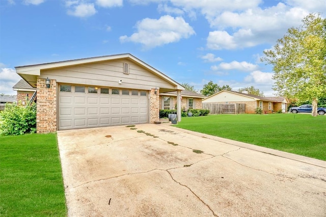 ranch-style home with a garage and a front lawn